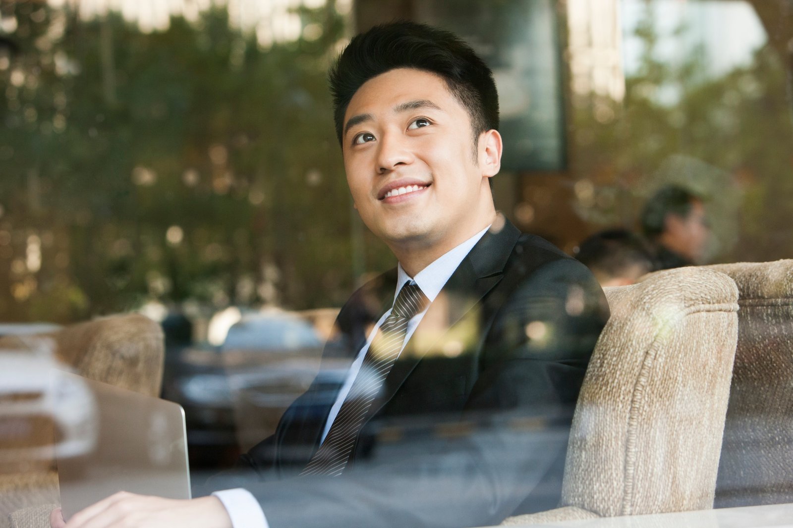 Cheerful businessman in cafe